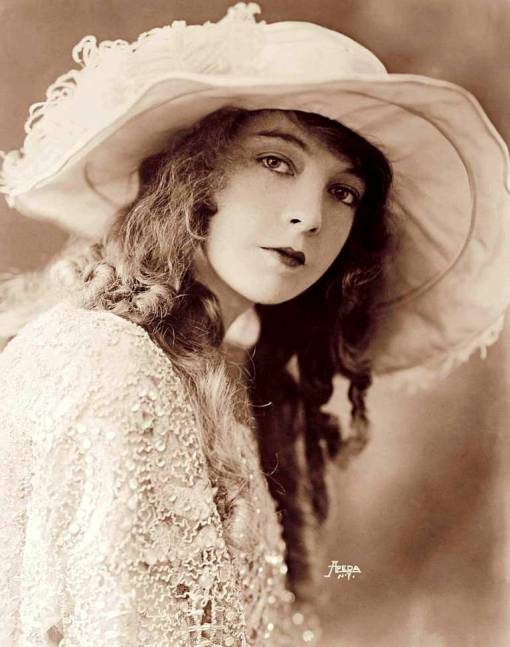 studio-portrait-apeda-n-y-movie-star-lillian-gish-wearing-elaborate-large-hat-and-lacy-shawl-three-quarters-looking-into-camera