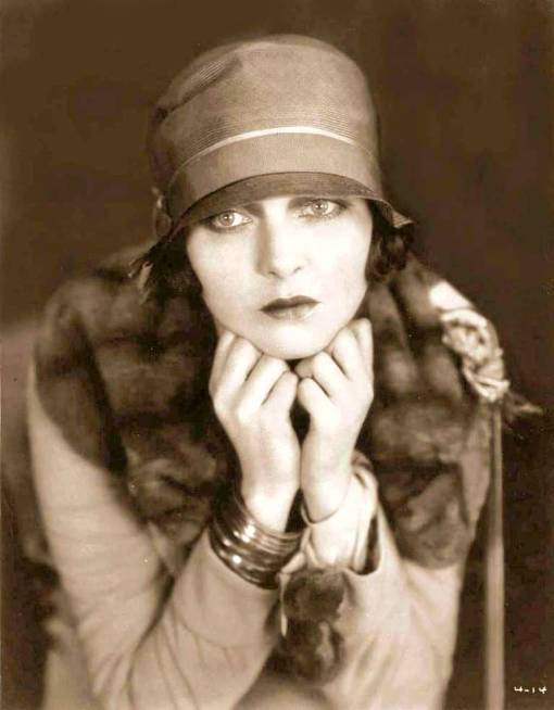 x-studio-portrait-movie-star-corinne-griffith-full-face-with-bucket-hat-and-hands-under-chin1
