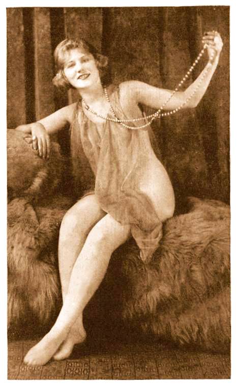 arcade-card-unknown-publisher-pin-up-woman-sitting-on-furs-with-long-string-of-pearls-and-wrapped-in-veil