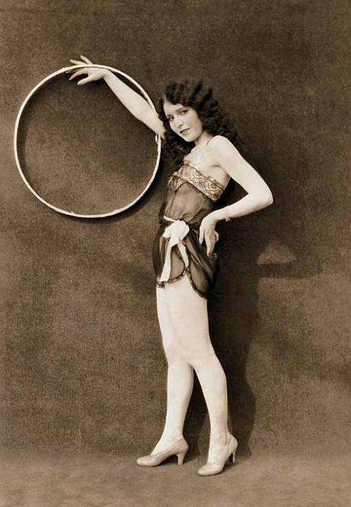 photo-for-arcade-card-exhibit-supply-company-pin-up-woman-profile-hand-on-hip-holding-large-hoop-1920s