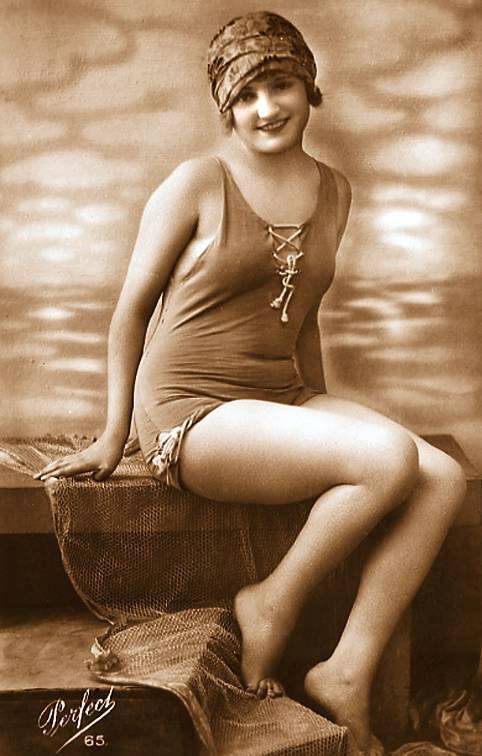 photo-for-arcade-card-woman-with-bathing-suit-and-cap-sitting-gracefully-on-set1