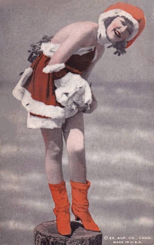 ARCADE CARD - EXHIBIT SUPPLY COMPANY - PIN UP - WOMAN IN SANTA-LIKE SHORTIE OUTFIT AND HAT AND BOOTS STANDING ON POST IN FRONT OF WATER SET - TINTED - 1920s